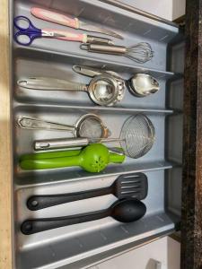 a drawer filled with lots of kitchen utensils at Lovely 2bed room AC apartment JP Nagar in Bangalore