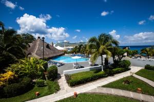 an aerial view of a resort with a swimming pool at Casa del Mar Cozumel Hotel & Dive Resort with free access to an exclusive beach club in Cozumel