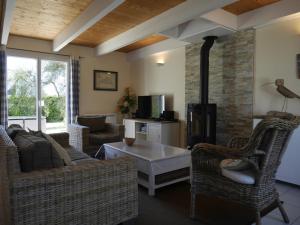 a living room with a couch and a fireplace at Maison Le Palais, 4 pièces, 6 personnes - FR-1-418-48 in Le Palais