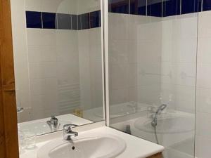 a bathroom with a sink and a shower and a tub at Appartement Orcières Merlette, 2 pièces, 4 personnes - FR-1-262-180 in Orcières