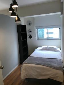 Ένα ή περισσότερα κρεβάτια σε δωμάτιο στο Hermoso apartamento con piscina Miraflores- Canvas +27 φωτογραφίες