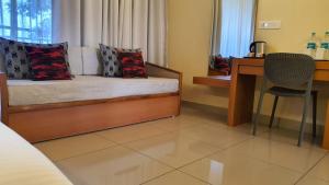 Katil atau katil-katil dalam bilik di Upavan Resort