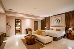 Postel nebo postele na pokoji v ubytování Crystalkuta Hotel - Bali