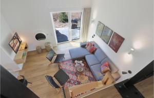 an overhead view of a living room with a blue couch at Awesome Home In Lembruch-dmmer See With Kitchen in Lembruch