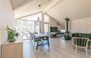 a dining room with a table and chairs at 3 Bedroom Awesome Home In Hasle in Hasle