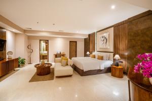 Postel nebo postele na pokoji v ubytování Crystalkuta Hotel - Bali