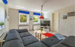 a living room with a couch and a table at 2 Bedroom Stunning Home In Lehe in Lehe