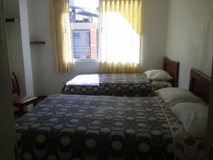 Postel nebo postele na pokoji v ubytování Hotel Ventura