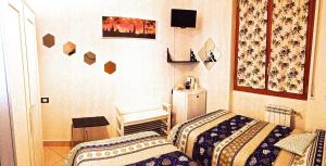 Кровать или кровати в номере Top Suit Centro - Guest house
