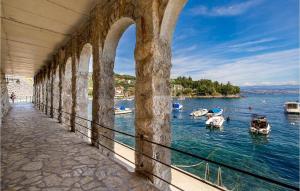 a view of a harbor with boats in the water at Beautiful Apartment In Lovran With 2 Bedrooms, Wifi And Jacuzzi in Lovran