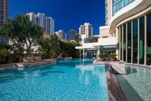 a large swimming pool in a city with buildings at Hotel Deluxe Twin at Legends - Q Stay in Gold Coast