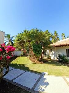 a yard with palm trees and a house at Beautiful Residence in Marina, Vallarta in Puerto Vallarta