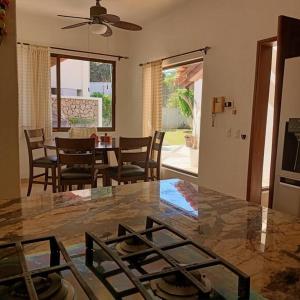 a kitchen and dining room with a table and chairs at Beautiful Residence in Marina, Vallarta in Puerto Vallarta