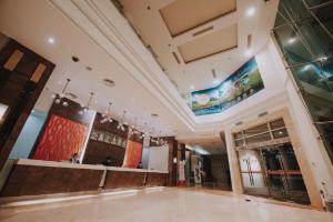 a large room with a dance floor in a building at Kingwood Hotel Sibu in Sibu