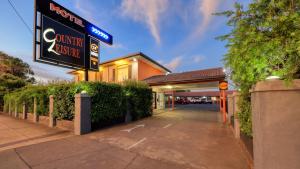 a hotel with a sign for a south exit at Country Leisure Motor Inn in Dubbo