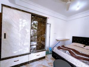 Postel nebo postele na pokoji v ubytování RVR Abode -Private Rooms