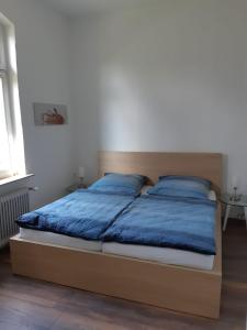 Postel nebo postele na pokoji v ubytování Nordtor