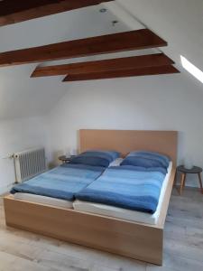 Postel nebo postele na pokoji v ubytování Nordtor