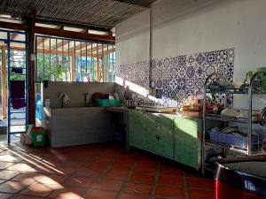 a kitchen with a sink and a counter top at Chunlii Homestay in Ke Ga