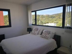 Ένα ή περισσότερα κρεβάτια σε δωμάτιο στο Precioso chalet vanguardista +25 φωτογραφίες