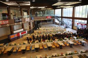 a group of people in a large room with tables and chairs at CLUB 21 by Sariska Fun City, Alwar in Mācheri