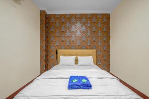 Posteľ alebo postele v izbe v ubytovaní Hotel Cempaka Sari
