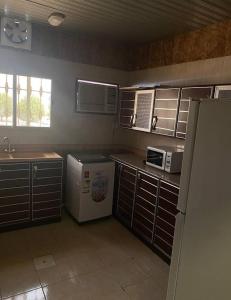 A kitchen or kitchenette at فندق أباهى3