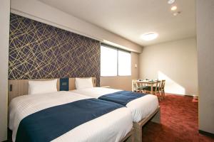 Ένα ή περισσότερα κρεβάτια σε δωμάτιο στο Minn Nihonbashi