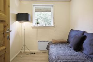TV a/nebo společenská místnost v ubytování Sommerhus ved Vesterhavet