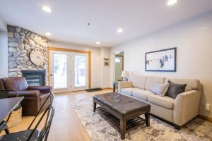a living room with a couch and a fireplace at Big Cottonwood 2 Bedroom Brighton Chalet in Brighton
