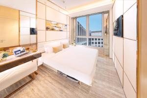 Voodi või voodid majutusasutuse Regala Skycity Hotel toas
