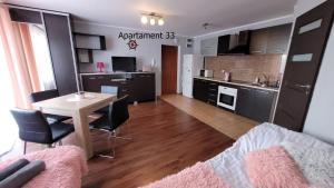 Kuchyňa alebo kuchynka v ubytovaní Apartament Rybacka 84B/33