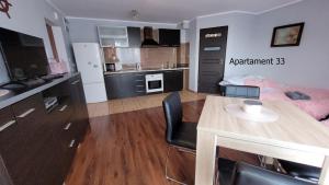 Kuchyňa alebo kuchynka v ubytovaní Apartament Rybacka 84B/33