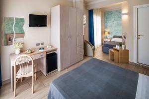 Postel nebo postele na pokoji v ubytování Hotel Olympic + 37 fotografií