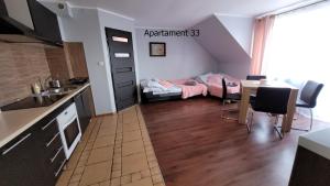 Kuchyňa alebo kuchynka v ubytovaní Apartament Rybacka 84B/33