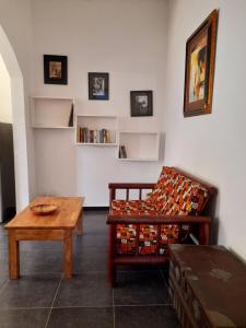 a living room with a couch and a table at Culture's apartment in Paje