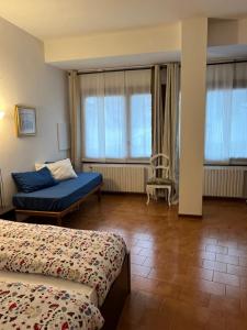 Postel nebo postele na pokoji v ubytování accogliente camera con bagno privato + 13 fotografií
