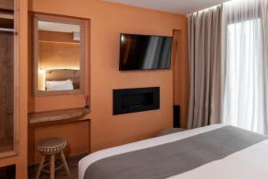 Televízia a/alebo spoločenská miestnosť v ubytovaní Minos by Agora Luxury Apartments in the heart of Heraklion
