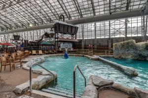 a large swimming pool in a large building at Jay Peak Village Home 367B in Jay
