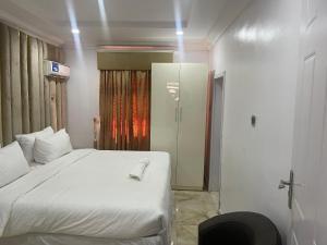 Ένα ή περισσότερα κρεβάτια σε δωμάτιο στο White Gold Hotel