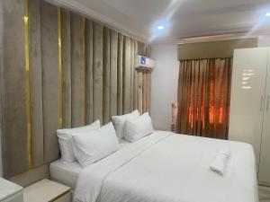 Ένα ή περισσότερα κρεβάτια σε δωμάτιο στο White Gold Hotel