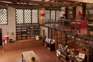 a large room filled with lots of wine bottles at Castello di Roncade in Roncade