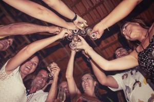 a group of people holding up wine glasses at Aldeia Mari-Mari Amazon Lodge in Presidente Figueiredo