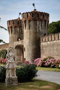 a statue of a girl in front of a castle at Castello di Roncade in Roncade