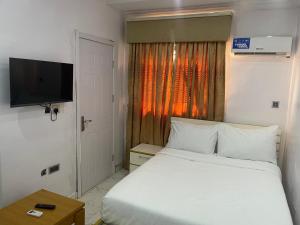 Ένα ή περισσότερα κρεβάτια σε δωμάτιο στο White Gold Hotel