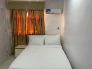 Ένα ή περισσότερα κρεβάτια σε δωμάτιο στο White Gold Hotel