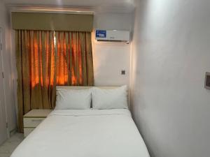 Ένα ή περισσότερα κρεβάτια σε δωμάτιο στο White Gold Hotel