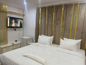 Ένα ή περισσότερα κρεβάτια σε δωμάτιο στο White Gold Hotel