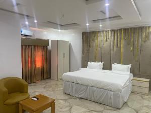 Ένα ή περισσότερα κρεβάτια σε δωμάτιο στο White Gold Hotel