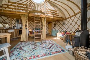 a room with a bed in a yurt at The Garlic Farm in Sandown +114 photos
